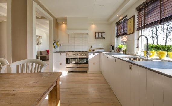 Spacious kitchen showcasing modern home extensions with wooden countertops and natural lighting.